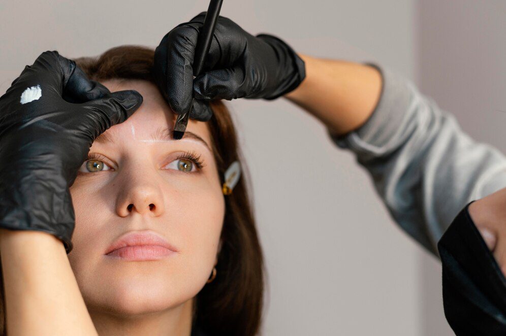 front-view-woman-getting-eyebrow-treatment-from-beautician